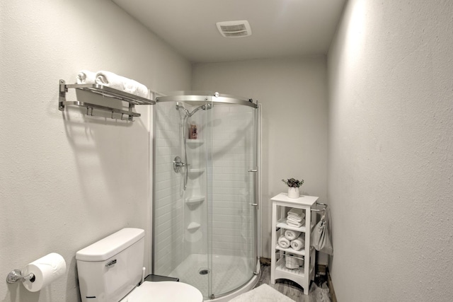 179 Oak St, Nocona, TX 76255 - bathroom featuring a shower stall and toilet
