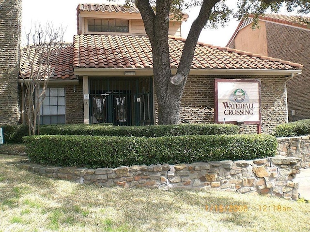 883 Dublin Dr Unit 1, Richardson, TX 75080 - view of front of home featuring a tiled roof