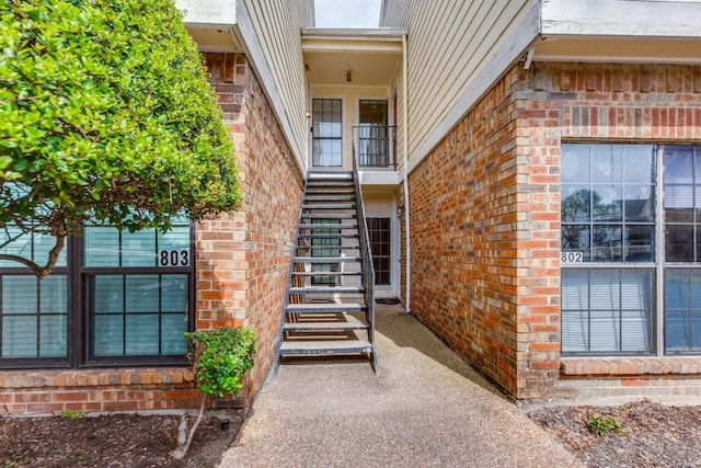 9601 Forest Ln Unit 822, Dallas, TX 75243 - doorway to property with brick siding