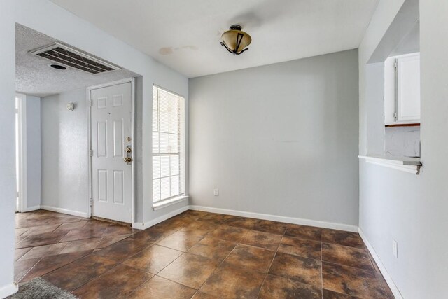 9601 Forest Ln Unit 822, Dallas, TX 75243 - entrance foyer with baseboards