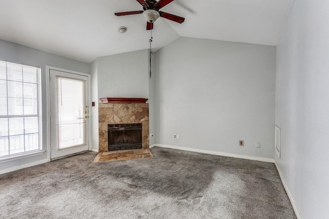 9601 Forest Ln Unit 822, Dallas, TX 75243 - unfurnished living room featuring a ceiling fan, lofted ceiling, healthy amount of natural light, carpet, and a fireplace