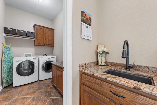 1527 Old Ranch Rd, China Spring, TX 76633 - laundry room featuring cabinet space, separate washer and dryer, stone finish flooring, and baseboards