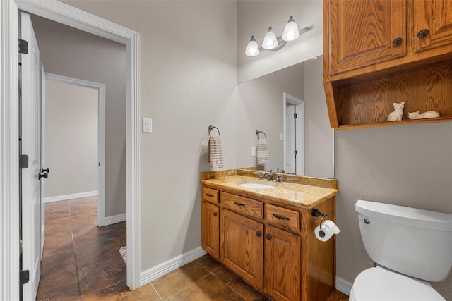 1527 Old Ranch Rd, China Spring, TX 76633 - half bathroom featuring toilet, vanity, and baseboards