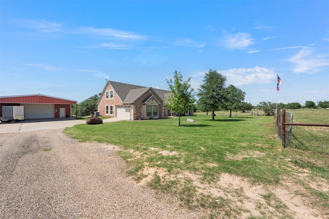 1527 Old Ranch Rd, China Spring, TX 76633 - view of front of house featuring driveway, a detached garage, an outbuilding, and brick siding