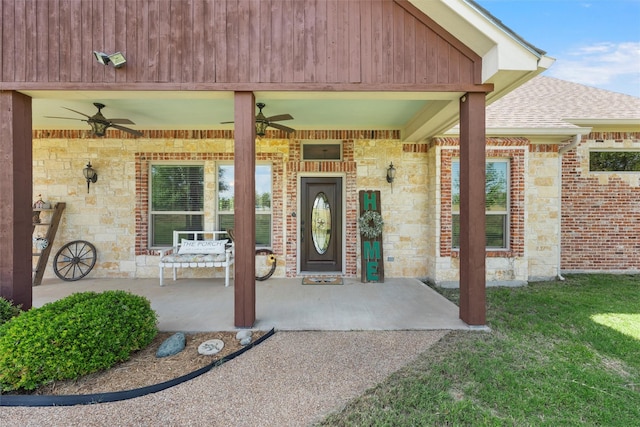 1527 Old Ranch Rd, China Spring, TX 76633 - entrance to property with ceiling fan, a shingled roof, stone siding, and a yard