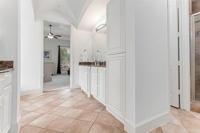 968 Fairfield Ln, Allen, TX 75013 - bathroom with vanity, a ceiling fan, a stall shower, baseboards, and tile patterned flooring