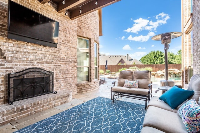 968 Fairfield Ln, Allen, TX 75013 - fenced backyard with an outdoor living space with a fireplace and a patio area