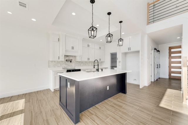 9320 Beckleycrest Ave, Dallas, TX 75232 - kitchen featuring baseboards, a sink, light countertops, white cabinets, and recessed lighting