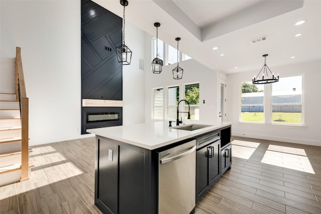 9320 Beckleycrest Ave, Dallas, TX 75232 - kitchen featuring a sink, stainless steel dishwasher, wood tiled floors, light countertops, and baseboards