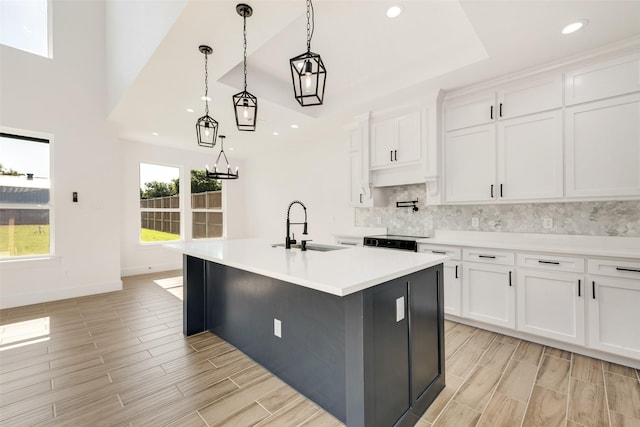 9320 Beckleycrest Ave, Dallas, TX 75232 - kitchen featuring a sink, backsplash, white cabinetry, light countertops, and recessed lighting