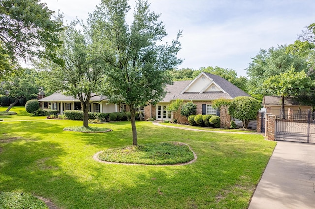 ranch-style house with a gate and french doors