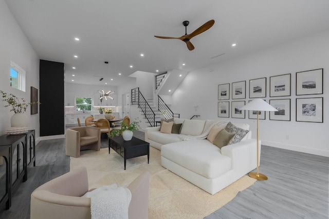 1921 Pollard St, Dallas, TX 75208 - living room with stairway, recessed lighting, a ceiling fan, light wood-style flooring, and baseboards