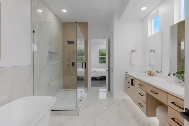 1921 Pollard St, Dallas, TX 75208 - ensuite bathroom featuring marble tiled floors, healthy amount of natural light, walk in shower, vanity, and recessed lighting