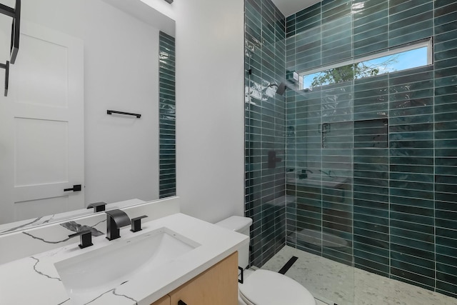 1921 Pollard St, Dallas, TX 75208 - full bathroom with a tile shower, toilet, and vanity