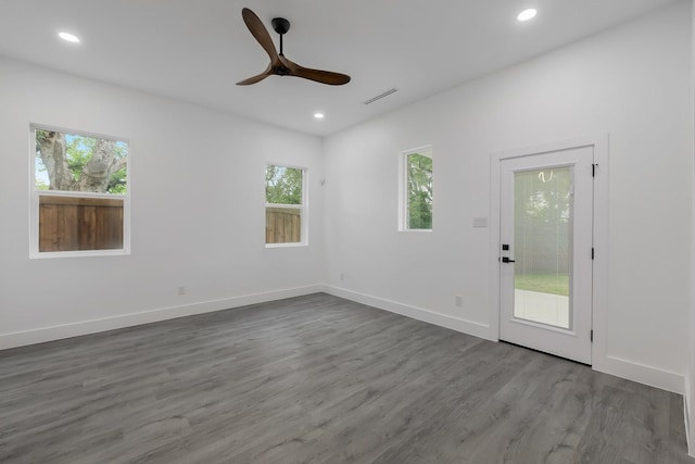 1921 Pollard St, Dallas, TX 75208 - spare room featuring plenty of natural light, a ceiling fan, recessed lighting, and wood finished floors