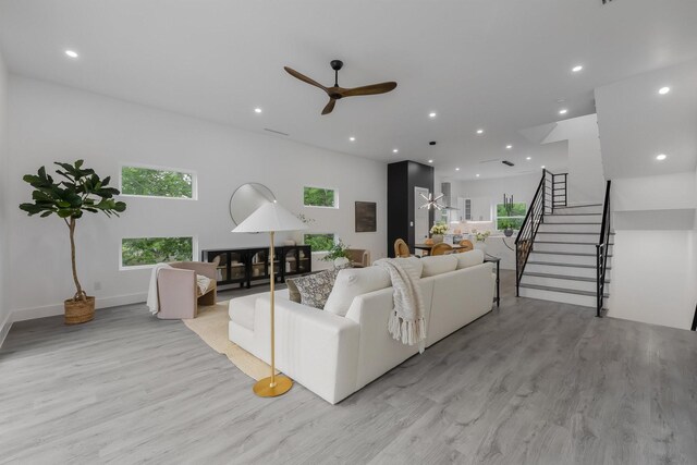 1921 Pollard St, Dallas, TX 75208 - living room featuring light wood-type flooring, stairway, recessed lighting, and ceiling fan