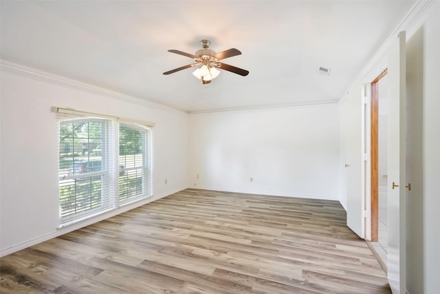 unfurnished room with light wood-style flooring, ceiling fan, ornamental molding, and baseboards