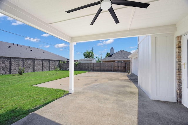view of patio featuring ceiling fan and concrete driveway