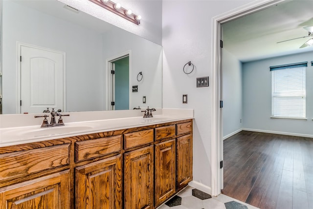2007 Brazoria Dr, Forney, TX 75126 - full bath with ceiling fan, double vanity, baseboards, and wood finished floors