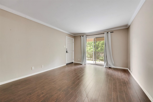 unfurnished room featuring baseboards, dark wood-style flooring, and crown molding