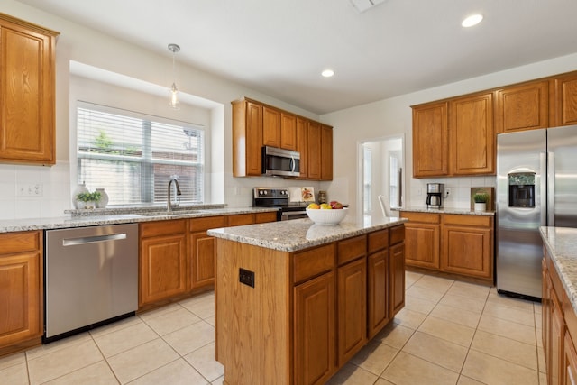 1016 Hidden Creek Ct, Allen, TX 75002 - kitchen featuring stainless steel appliances, a sink, backsplash, brown cabinets, and recessed lighting
