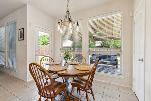 1016 Hidden Creek Ct, Allen, TX 75002 - dining area with light tile patterned flooring, baseboards, and plenty of natural light