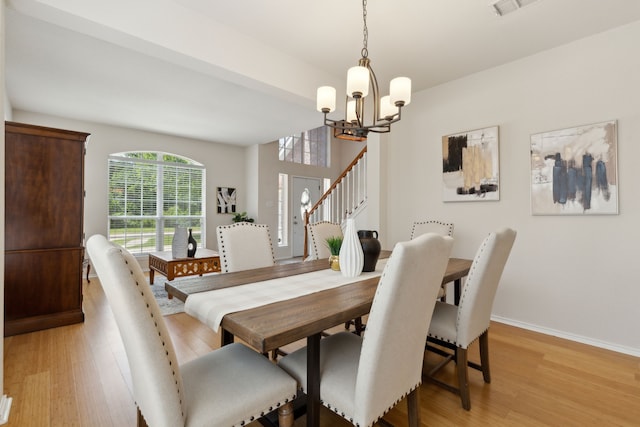 1016 Hidden Creek Ct, Allen, TX 75002 - dining space featuring a chandelier, light wood-type flooring, baseboards, and stairway