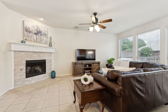 1016 Hidden Creek Ct, Allen, TX 75002 - living room featuring ceiling fan, light tile patterned flooring, a fireplace, and baseboards