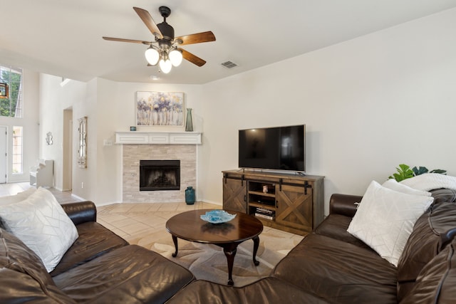 1016 Hidden Creek Ct, Allen, TX 75002 - living area featuring ceiling fan, a fireplace, and baseboards
