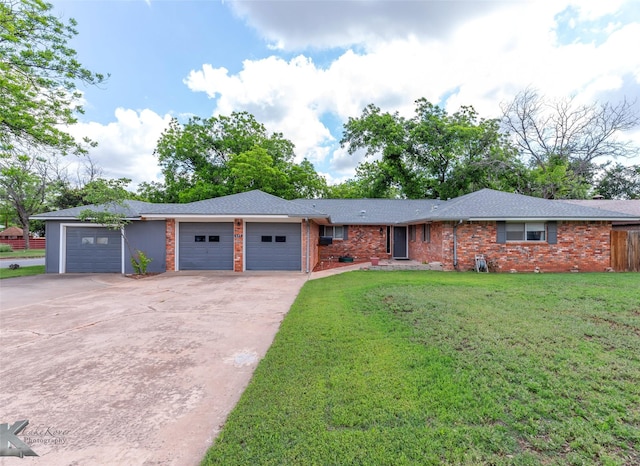 649 Westwood Dr, Abilene, TX 79603 - single story home featuring an attached garage, driveway, brick siding, and roof with shingles