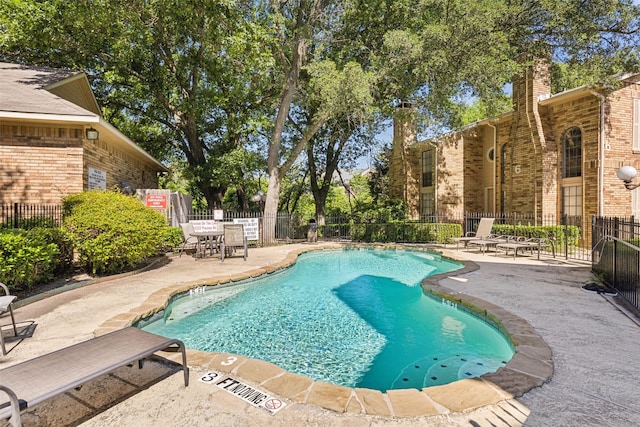 14333 Preston Rd Unit 1103, Dallas, TX 75254 - community pool with a patio and fence