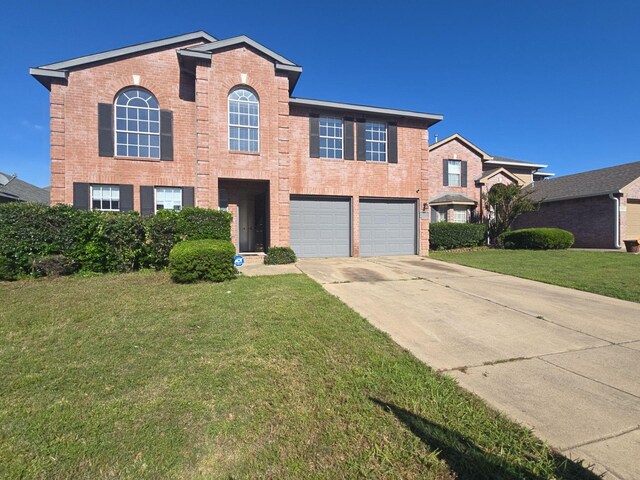 8313 French Quarter Ln, Fort Worth, TX 76123 - traditional-style home featuring driveway, brick siding, a garage, and a front yard