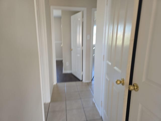 8313 French Quarter Ln, Fort Worth, TX 76123 - hallway with light tile patterned floors and baseboards