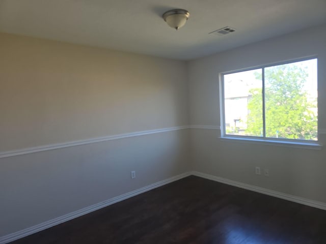 8313 French Quarter Ln, Fort Worth, TX 76123 - unfurnished room with dark wood-style floors and baseboards