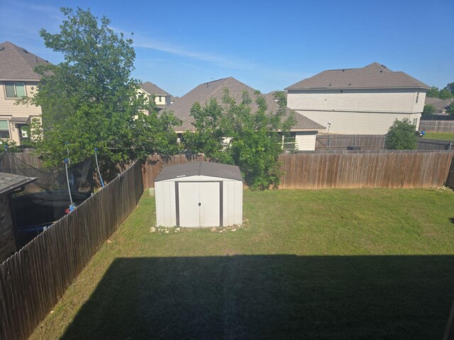 8313 French Quarter Ln, Fort Worth, TX 76123 - view of yard featuring a storage unit, an outdoor structure, and a residential view
