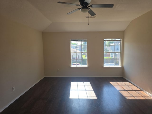 8313 French Quarter Ln, Fort Worth, TX 76123 - unfurnished room featuring vaulted ceiling, dark wood-type flooring, a ceiling fan, and baseboards