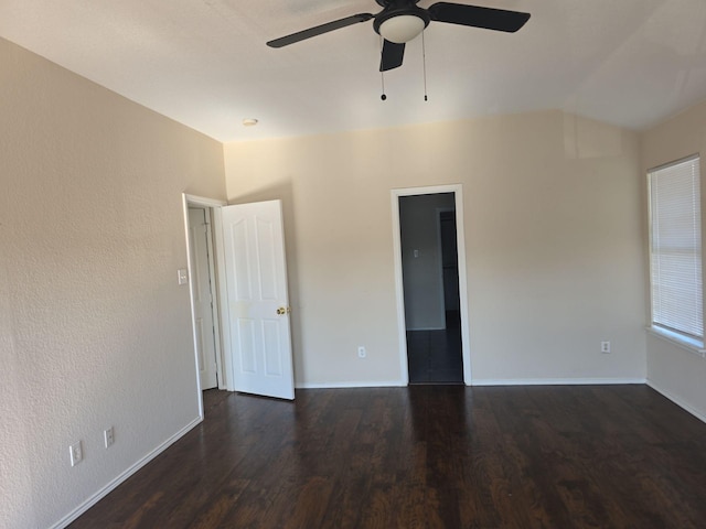 8313 French Quarter Ln, Fort Worth, TX 76123 - spare room with ceiling fan, dark wood-style flooring, vaulted ceiling, and baseboards
