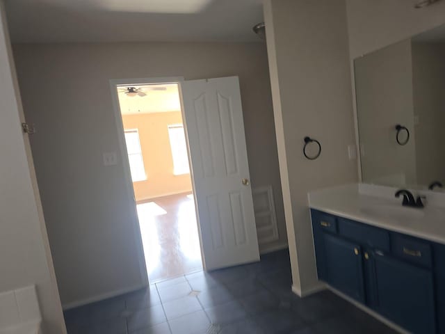 8313 French Quarter Ln, Fort Worth, TX 76123 - bathroom with tile patterned flooring, a ceiling fan, vanity, and baseboards
