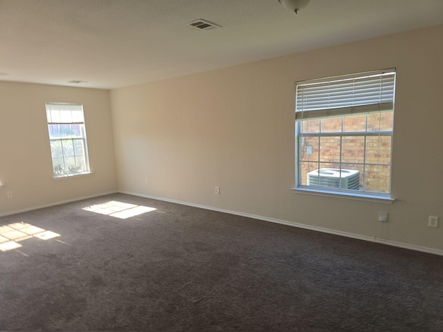 8313 French Quarter Ln, Fort Worth, TX 76123 - unfurnished room with dark colored carpet and baseboards