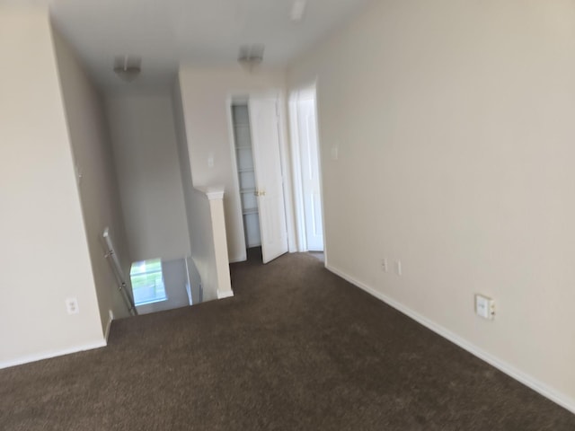 8313 French Quarter Ln, Fort Worth, TX 76123 - spare room featuring dark colored carpet and baseboards