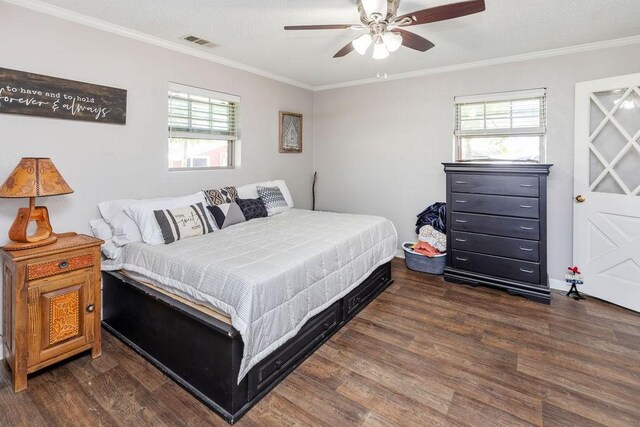 9216 Fm 195, Paris, TX 75462 - bedroom with wood finished floors, crown molding, multiple windows, and a ceiling fan