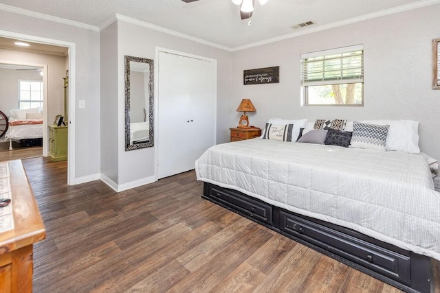 9216 Fm 195, Paris, TX 75462 - bedroom featuring wood finished floors, ornamental molding, baseboards, and a closet