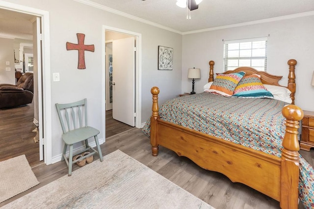 9216 Fm 195, Paris, TX 75462 - bedroom featuring ornamental molding, wood finished floors, a ceiling fan, and baseboards