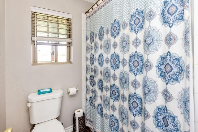 9216 Fm 195, Paris, TX 75462 - bathroom featuring toilet and curtained shower