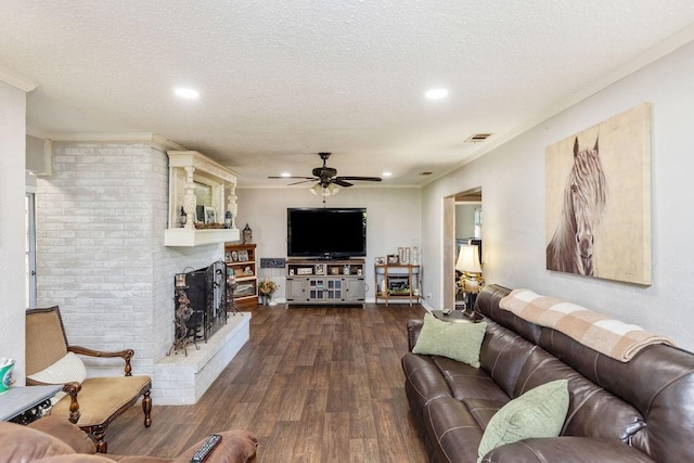 9216 Fm 195, Paris, TX 75462 - living room featuring a ceiling fan, wood-type flooring, a textured ceiling, a brick fireplace, and recessed lighting