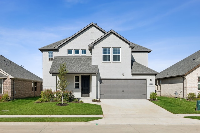 611 Rain Barrel Pl, Celina, TX 75097 - view of front of property with brick siding, a front yard, driveway, and an attached garage
