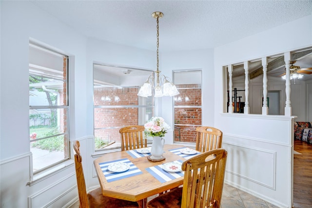 5808 Arbor Valley Dr, Arlington, TX 76016 - dining room featuring a chandelier, a textured ceiling, and a ceiling fan