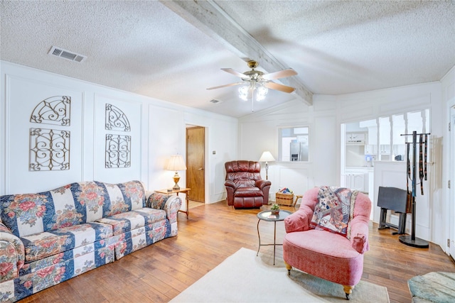 5808 Arbor Valley Dr, Arlington, TX 76016 - living area featuring a textured ceiling, hardwood / wood-style flooring, and ceiling fan