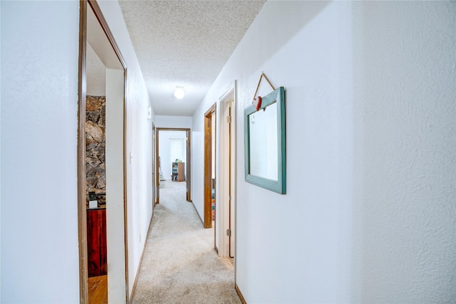 5808 Arbor Valley Dr, Arlington, TX 76016 - hallway featuring a textured ceiling and light carpet