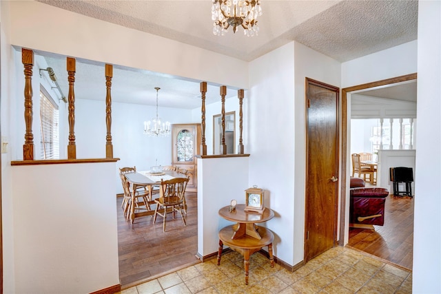 5808 Arbor Valley Dr, Arlington, TX 76016 - hall featuring a chandelier, baseboards, and a textured ceiling